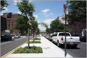Photo of a road with a median.