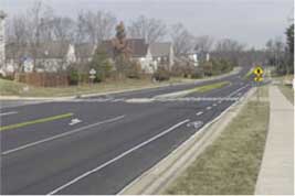 Photo of a road with a median.
