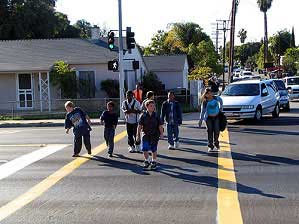 Photo of people crossing the street