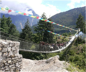 Photo of a suspension rope bridge.