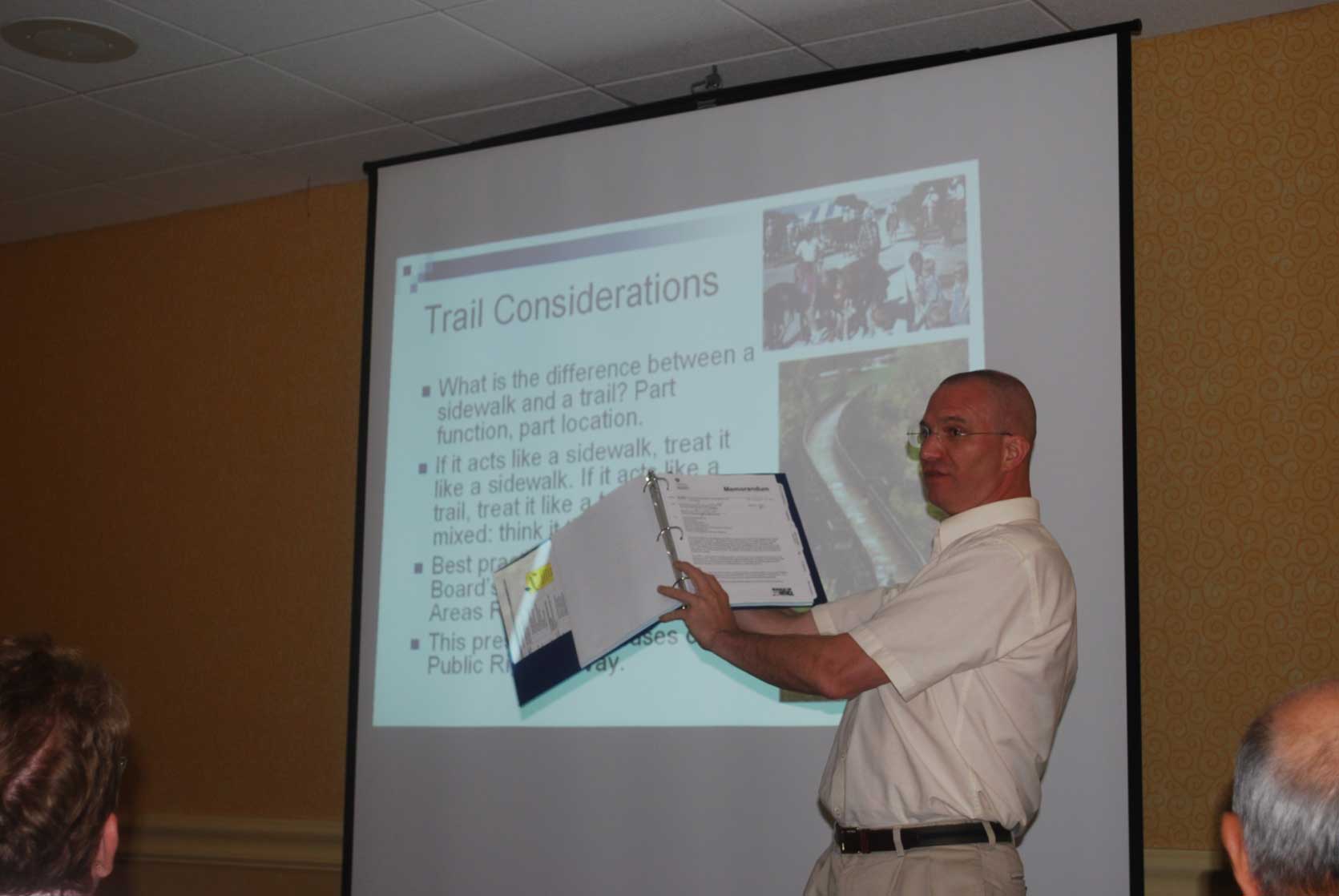 Photo of Christopher Douwes giving a Powerpoint presentation.