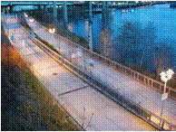 Photo of wide paved trail over water.