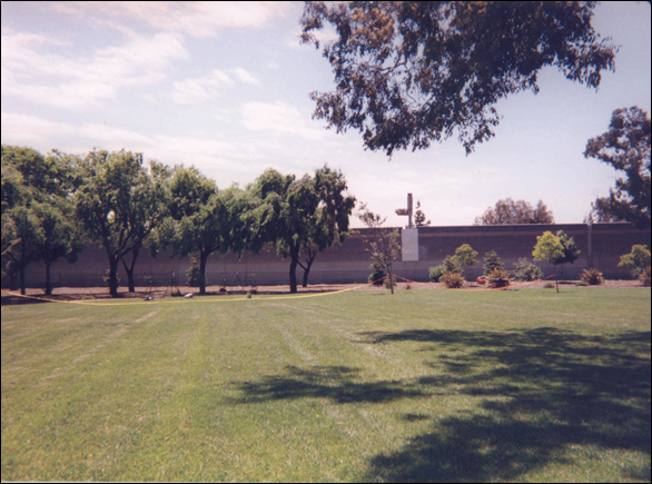 Photograph of Site 14CA showing a lawn and barrier.