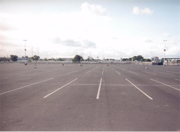 Photograph of Site 15CA showing an empty parking lot.