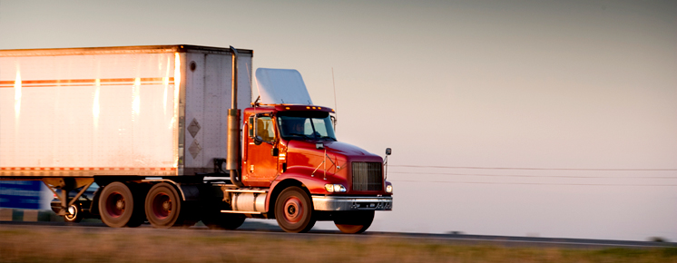 Truck traveling down a highway