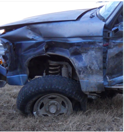 Photo 5 shows damaged vehicle for Case #2B002
