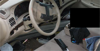 Photo 38 shows damaged vehicle interior for Case # 2B008