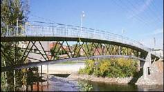The Sherbrooke Pedestrian Bridge, Quebec (1997) is the first Ductal ® bridge world-wide, spanning 60m with a space truss, 6 precast segments (10 m long x 3 m high) and a top deck just 30 mm thick. With no passive reinforcement, this revolutionary bridge provided important validation of Ductal ® as a superior, "ultra-high performance concrete" material and opened the door to innovative new possibilities in the world of bridge design and construction. This project won a Precast/Prestressed Concrete Institute (PCI) Design Award.