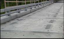 The Rainy Lake Bridge, Ontario (2006) is the world's first Ductal ® Joint Fill ("JS1000") project; part of an innovative field cast joint solution for a bridge superstructure/precast deck panel system specially developed for the Ministry of Transportation of Ontario.  Through its design, testing and construction, this project validated a precast bridge deck with a 200 mm wide joint (conventional design is 600 mm wide) and led the way to other, repetitive joint fill projects.