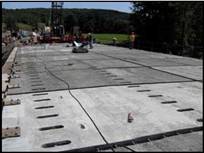 Oneonta, New York (2009) is built with 22 precast slabs jointed on top of 5 steel girders (slab thickness: 200 mm).