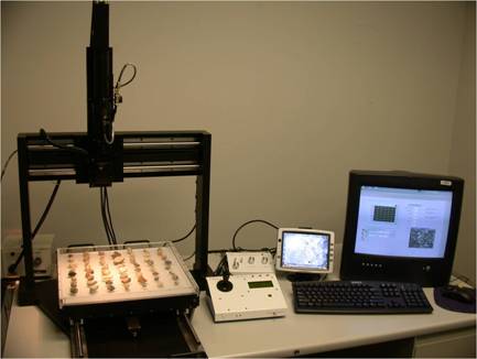 The AIMS one is a lighted x/y table with a camera/microscope mounted above the x/y table. A joystick allows the operator to locate the home point to begin the test. Included with the AIMS I is a computer workstation to collect the measurements and evaluate the data.