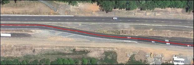 Figure 11. Photo. US-15/501 southern crossover – standard pavement marking and the AWP study site. Figure 11. Photo. US-15/501 southern crossover – standard pavement marking and the AWP study site.