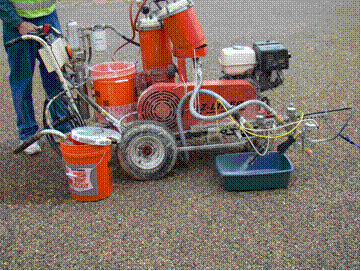 This image shows a profile view of the EZ Liner pavement marking installation cart while stationary. The nozzle is open and dropping beads into a bucket for calibration of the drop rate. The second and third picture shows a crew member emptying the bucket into a vile and measuring the total volume of the beads dropped into the bucket during calibration.