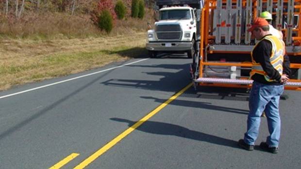 The robotic arm can be retracted when a large truck passes by to improve safety.