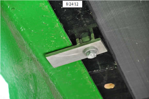 Figure 19. Photo. Installed clip. Methacrylate adhesive can be used to fill voids above or below prefabricated haunches to ensure uniform bearing. This was done on 9/4/2012.