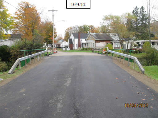 Figure 31. Photo. Install bridge railing posts, rails, and approach railing.