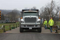 c) Photograph of truck on load path A, load case 8