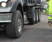 d) Photograph of truck on load path A, load case 4