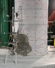 Figure 26. Photos. Comparison of test specimens after one cycle to drift of 4.3 percent. Comparison of column damage after loading to 4.3 percent drift for the three spread footing socket connection test specimens. SF-1 and SF-2 show spalling extending 10 and 12 inches above the top of footing, respectively, while SF-3 only had spalling along 7 inches of the column above the top of the footing.