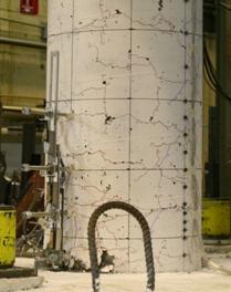 Figure 26. Photos. Comparison of test specimens after one cycle to drift of 4.3 percent. Comparison of column damage after loading to 4.3 percent drift for the three spread footing socket connection test specimens. SF-1 and SF-2 show spalling extending 10 and 12 inches above the top of footing, respectively, while SF-3 only had spalling along 7 inches of the column above the top of the footing.