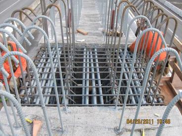 Figure 54. Photo. Lower-stage cap beam closure prior to concrete placement. Showing the congestion of reinforcing steel at the closure location.