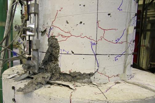 As the column was cycled more, the damage in the plastic hinge region became more pronounced.