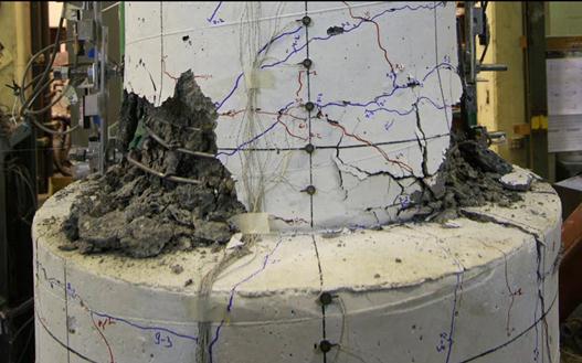 This photo shows the plastic hinge region of specimen DS-1 after cyclic testing.