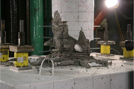 After cyclic testing, the column was pushed axially in an attempt to punch the precast column through the spread footing. The column crushed at 819.5 kips load before the column could punch through the spread footing.