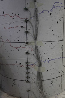 Photo shows horizontal crack formed near the column-to-footing interface.