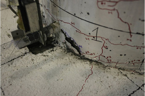 Photo shows first column spalling forming in cycle 6-2.