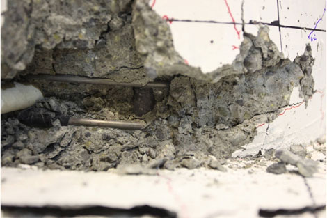 Longitudinal bar became first visible in cycle 9-3 near the column-to-spread footing interface.