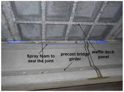 Photo of water-tight seal at panel to girder connection using quick setting spray