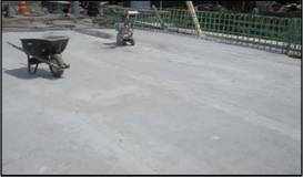 Fig. 16 Top view of bridge deck before applying asphalt overlay. Showing UHPC Joint Fill and side-by-side Deck Bulb-Tees.