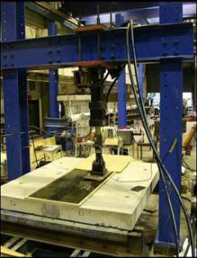 Fig. 7 Bridge deck panels with water ponding under fatigue loading (courtesy of FHWA)