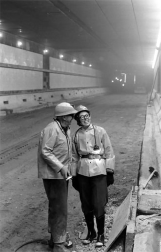 Eisenhower Tunnel: Engineer Janet Bonnema with Rueben Hopper, Colorado Highway Department district engineer, in the Eisenhower Tunnel