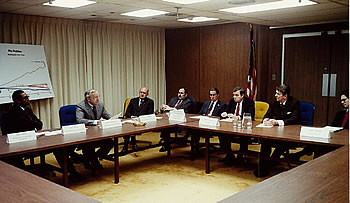 Administrator Ray Barnhart explains to President Reagan the need for additional revenue.