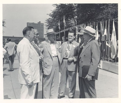 General Philip B. Fleming, Administrator of the Federal Works Agency, home of the Public Roads Administration, with Director Charles Upham and group at the 1948 convention of the American Road Builders Association in Chicago.