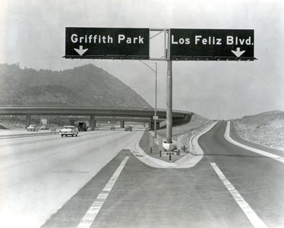 California - Ground view of the Las Feliz Boulevard interchange showing the signing, striping, and the single circular, column bents on the Las Feliz Boulevard on-ramp structure.  Signs on Golden State Freeway - Aug. 15, 1958.