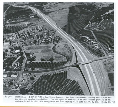 California - San Diego Freeway, San Juan Capistrano looking north with the new project nearing completion.  The old Spanish Mission is at left center portion of the photograph and in the left background the new highway ties into old U.S. 101.  Sept. 26, 58.