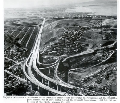California - Interstate 80 at Carquinez Straits with new bridge in foreground and the 8 million yard benched cut at left center beyond the Crockett interchange.  Old U.S. 40 can be seen at the right.  January 29, 1959.