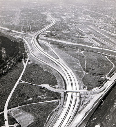 Golden State Freeway looking northwest across northeast corner of Griffith Park. Three-leg connection to Victory Street in upper left, future connection from south east Colorado Freeway to  right (stubs shown). California Department of Public Works photo