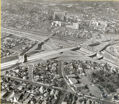 Interstate 5 Interchange with Interstate 10 looking northerly.  To the right is the San Bernardino Freeway toward Pomona.  To the left is Los Angeles. State Street structure is directly in front of the County Hospital.  Nov. 15, 1959.