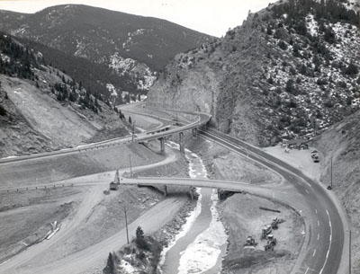 Colorado - Interstate Route 70 westerly from Denver (Colorado Interstate Project I-70-3(1)250)). View looking northwest showing the Floyd Hill interchange completed except for a small amount of cleanup work.  The project was officially opened to traffic on Dec. 11, 1959.