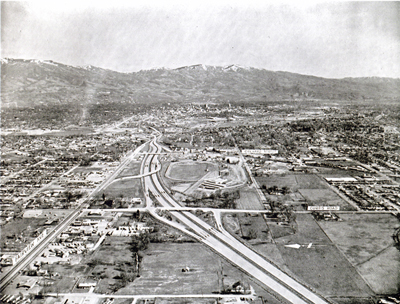 Idaho - Looking east on revised photograph of the Interstate spur leading into Boise.  The seciton beyond Orchard Street is under construction and the section in lower half of the photo is advertised for bids July 1967.  Looking east.