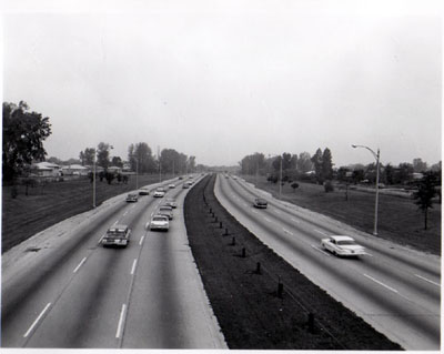 Interstate 94 (Edens Expressway) View showing 6 traffic lanes, 24 foot median with steel cable guard rail - looking N.W. from Oakton St. Chicago, Illinois.
