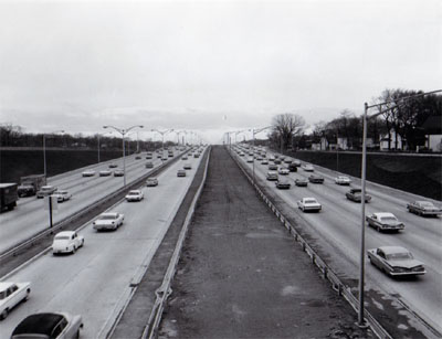 Interstate 94 Chicago, Illinois.  View of Northwest Expressway showing heavy traffic on a section of reversible roadway with 6 lanes of traffic.  Looking West from Irving Park overpass.
