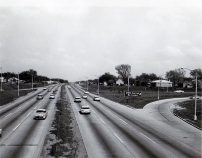 View of Congress Street, Expressway looking East from 25th Avenue overpass showing exit ramp right and traffic on Congress Street Expressway.