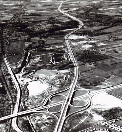 Interstate Route 74 and 465 meet on the west side of Indianapolis, Ind.  Interstate 465, running across the picture, is part of the Indianapolis circumferential freeway.