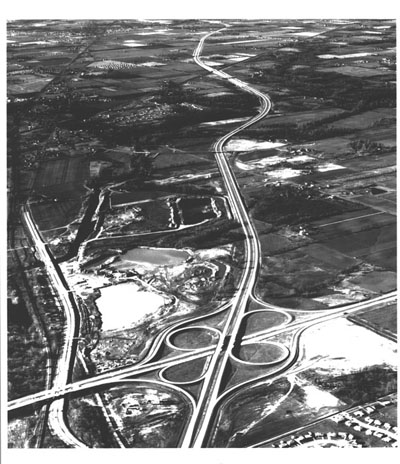Indiana - Interstate Routes 74 & 465 meet on the west side of Indianapolis. Interstate 465, running across the picture, is part of the Indianapolis circumferential freeway.