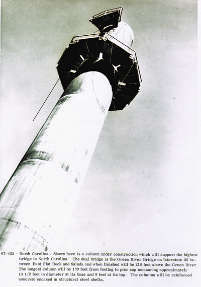 North Carolina - Shown here is column under construction which will support the highest bridge in North Carolina.  The dual bridge is the Green River Bridge on Interstate 26 between East Flat Rock and Saluda and when finished will be 218 feet above the Green River.  The longest column will be 139 feet from footing to pier cap measuring approximately 13 1/2 feet in diameter at its base and 9 feet at its top.  The columns will be reinforced concrete encased in structural steel shells.